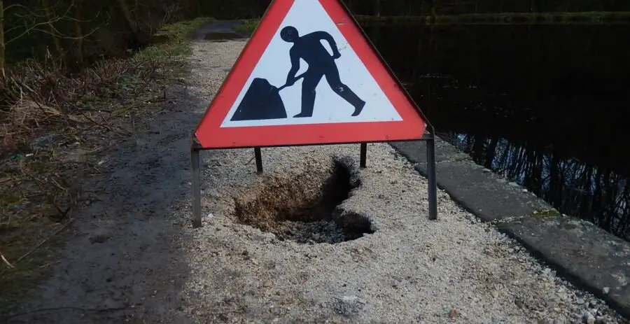 Holes sometimes appear in the dam wall, meaning that the footpath is occasionally shut whilst repairs are carried out.  Photo Sue Shaw, January 2015.